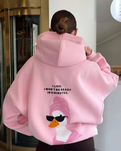 Detail of pink oversized hoodie showing humorous quote print on the back fabric