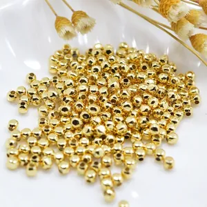 Polished gold round spacer beads for DIY jewelry making with smooth metallic finish