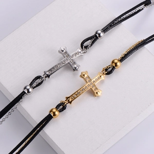 Double-layer stainless steel cross bracelet with diamonds and black woven rope chain