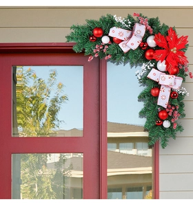 L-shaped Christmas door corner garland with red poinsettia and festive white berry details