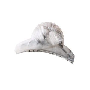 Close-up of shell-shaped large shark hair clip with grey-white marble texture