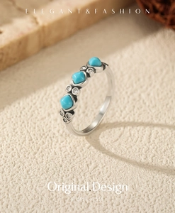Macro detail of S925 silver ring featuring blue turquoise stones and zircon accents