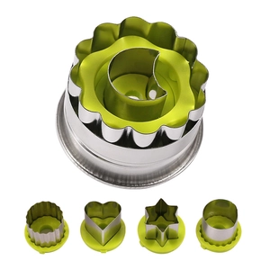 Stainless steel cookie cutter set with green plastic grips for baking and flower shapes