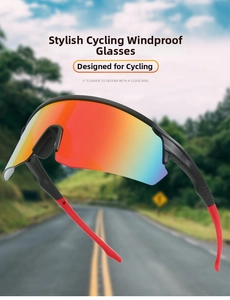Close-up of cycling sunglasses with red-orange gradient lens and matte black frame