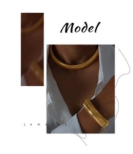 Macro shot of gold-plated titanium steel necklace and bracelet with twisted link design