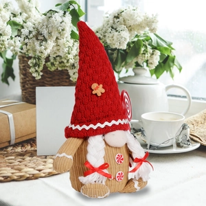 Gingerbread Christmas gnome decoration with red hat and candy details on a cozy windowsill