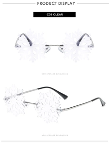 Macro shot of silver metal hinges and clear snowflake-shaped rimless lenses