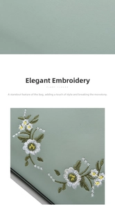 Detail of white daisy embroidery and fine texture on soft light green leather bag