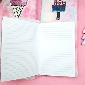 Detail of sequin ice cream embroidery on gradient plush cover and lined paper