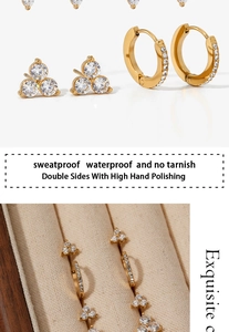 Macro detail of sweatproof gold clover stud and tarnish-free zircon round hoop earrings