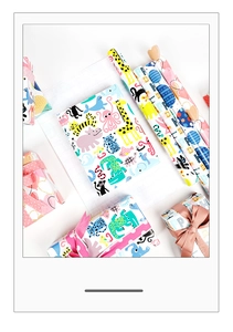 Colorful birthday gift wrap with cartoon animal prints and gift box examples