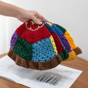 Handmade colorful crochet bucket hat with vibrant bohemian patchwork knit design
