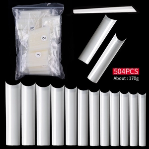 Macro detail of 504pcs XXL C-curve half cover square nail tips in milky white packaging