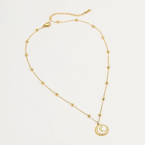 Close-up of 18K gold stainless steel moon pendant with bead chain and white inlay
