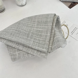 Detail of grey and white checkered placemat texture with elegant minimalist table setting