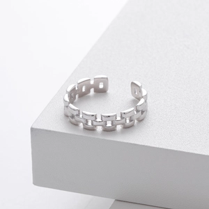 Macro shot of S925 sterling silver hallmark on an industrial chain link open ring