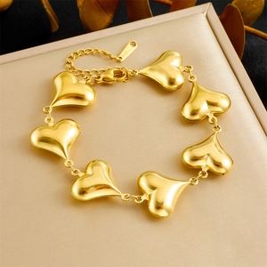 Elegant gold heart link stainless steel bracelet presented in a luxury jewelry gift box