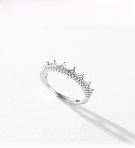 Macro shot of silver crown ring with micro-pave cubic zirconia and S925 hallmark stamp
