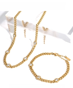 Detail of gold Cuban chain necklace and bracelet set with round cubic zirconia stones