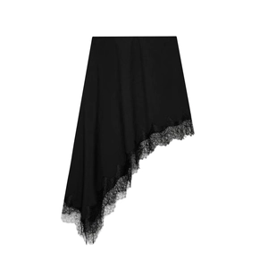 Detail of asymmetrical black skirt featuring delicate eyelash lace trim and silky fabric