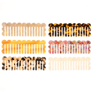 Set of six wide-tooth acetate hair combs featuring assorted marble and tortoise patterns