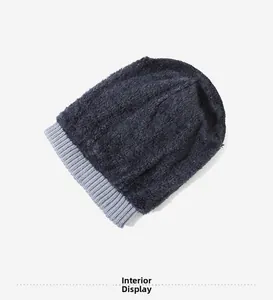 Detail of warm winter knit hat showing thick fleece lining and grey ribbed edge