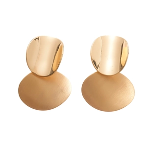 Minimalist gold oval earrings with a brushed matte finish and polished stud on white background