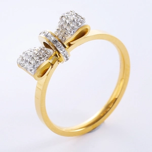 Elegant gold bow ring with sparkling rhinestones for women shown at a 45-degree angle