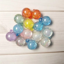 Close-up of colorful 16mm star glass ball charms for DIY jewelry and earrings