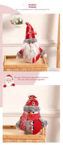 Detail of Christmas plush ornaments featuring Santa and Snowman in knitted fabric and sequins