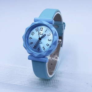 Detail view of light blue jelly watch featuring a heart-tipped second hand and gear-style bezel