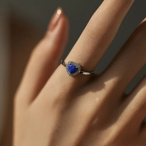 Elegant S925 silver ring featuring a blue heart-shaped opal surrounded by small diamonds