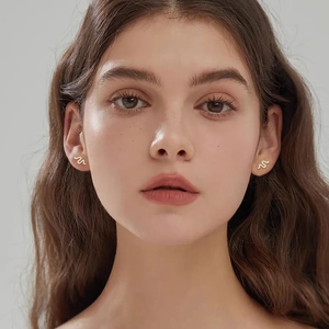 Elegant gold snake stud earrings with moissanite on model, S925 sterling silver jewelry