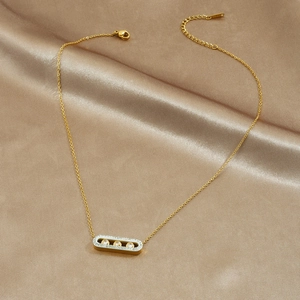 Gold-plated stainless steel paperclip necklace with three sliding diamonds on silk