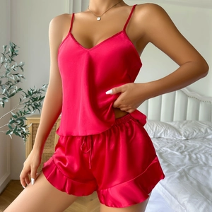 Red two-piece silk-like satin pajama set for women with V-neck camisole and ruffle shorts