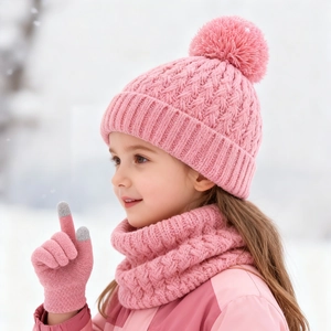 Pink knit hat scarf and gloves set for kids with fuzzy pom pom in winter snow scene