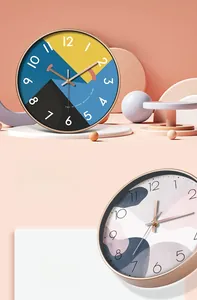 Detail of artistic round wall clock featuring geometric patterns and metal hands