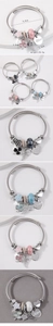 Detail showing stainless steel beaded bracelet dimensions and star heart wing pendants