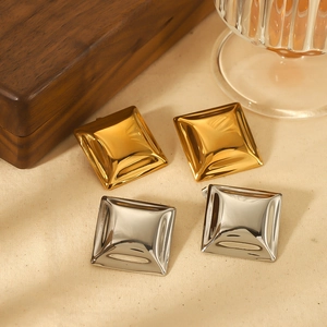 Detailed view of square convex 18K gold and silver plated stainless steel earrings