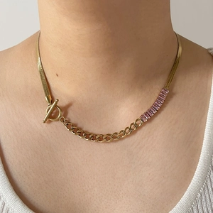Gold stainless steel snake chain necklace with pink zircon accents and OT clasp
