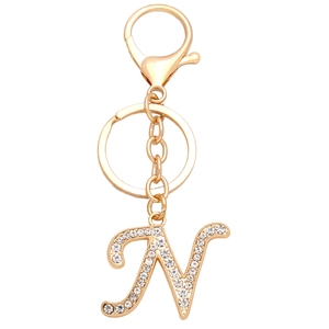 Detailed close-up of golden alphabet letter N keychain with sparkling inlaid rhinestones