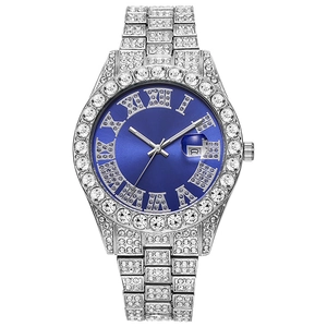 Macro shot of a luxury blue dial watch with diamond-encrusted bezel and silver roman numerals