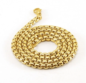 Macro view of 18K gold plated stainless steel box chain necklace with lobster clasp