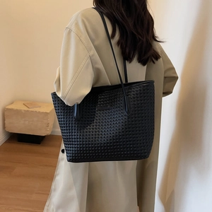 Fashionable black woven tote bag for women, spacious minimalist shoulder bag for commute