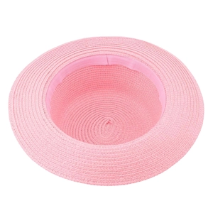 Detail of pink straw hat showing interior sweatband and tight weaving texture