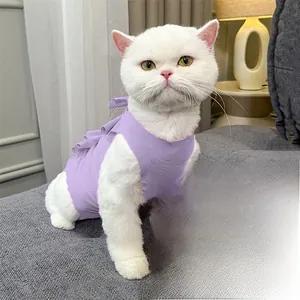 Detailed view of the lavender recovery suit with ruffled edges on a cat model