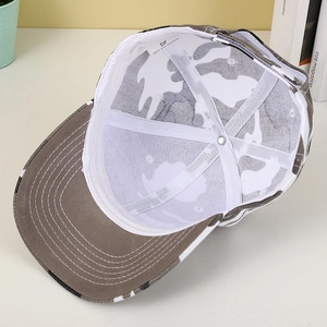 Inside view of camouflage baseball cap showing polyester fabric lining and stitching
