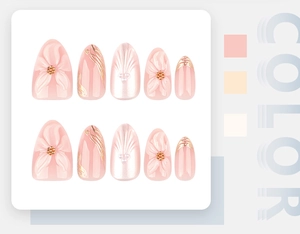 Detail of 3D embossed floral press-on nails with pearl accents and golden glitter lines