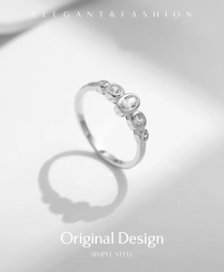 Detail of S925 sterling silver ring with five sparkling white cubic zirconia stones