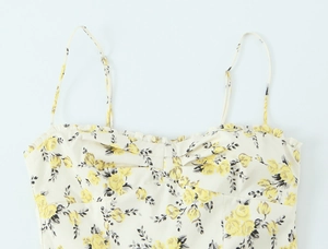 Detailed view of yellow floral poplin camisole with pleated neckline and straps